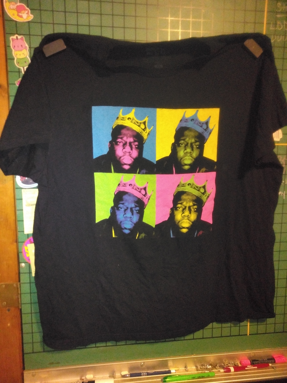 Black Short-Sleeve Graphic Tee with Color Block Portraits Of Biggie Smalls.